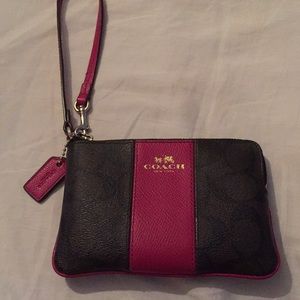 Coach raspberry colored wristlet.